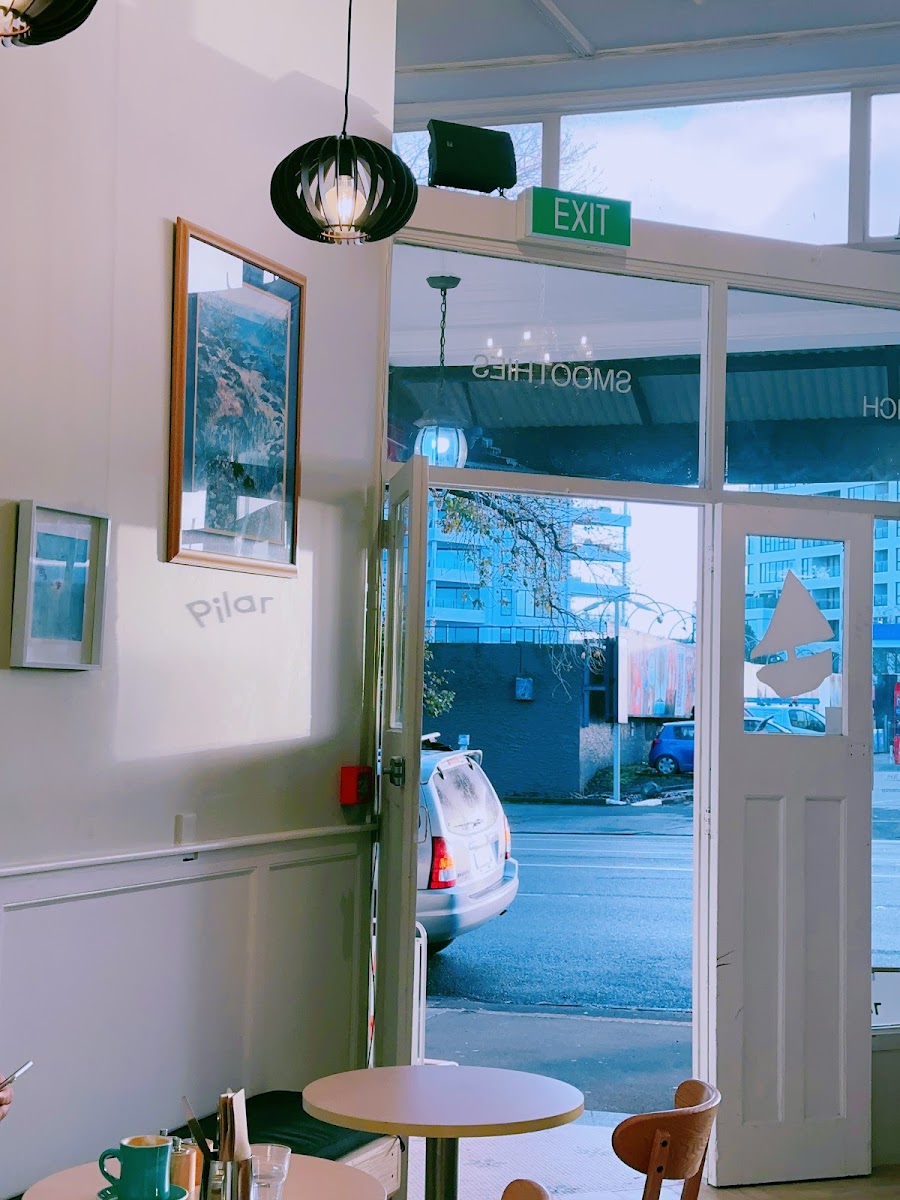 Pilar Cafe & Eatery exterior with mint outdoor tables on Ponsonby Road